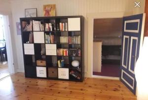 a book shelf filled with books in a room at Kylstad Bed and Breakfast in Kylstad