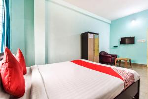 Postel nebo postele na pokoji v ubytování Hotel O Tm Delights