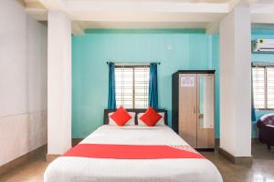 Postel nebo postele na pokoji v ubytování Hotel O Tm Delights
