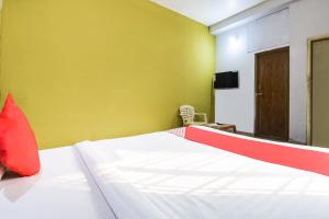 Postel nebo postele na pokoji v ubytování Hotel O Tm Delights