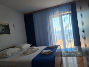 Łóżko lub łóżka w pokoju w obiekcie Rooms Raos