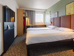 Postel nebo postele na pokoji v ubytování Hotel ibis Rennes Centre Gare Sud