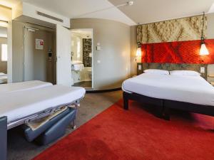 Postel nebo postele na pokoji v ubytování Hotel ibis Rennes Centre Gare Sud