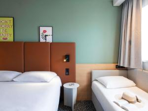 Postel nebo postele na pokoji v ubytování Hotel ibis Rennes Centre Gare Sud