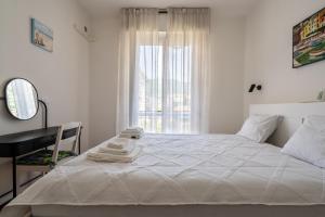 Ένα ή περισσότερα κρεβάτια σε δωμάτιο στο Elegant Apartments Rapallo