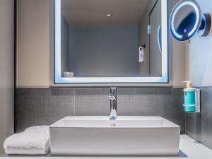 Ванная комната в Novotel Setubal
