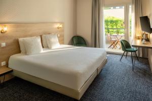 Postel nebo postele na pokoji v ubytování Best Western Hotel Fontaine Argent