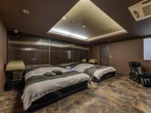 Postel nebo postele na pokoji v ubytování HOTEL felice Osaka -伊丹空港-
