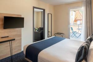 TV a/nebo společenská místnost v ubytování Best Western Hotel Fontaine Argent