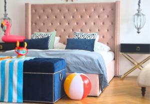 a bedroom with a bed with a beach ball on the floor at Prawdzic Family Resort & Wellness in Gdańsk