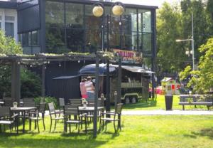 a group of people standing in front of a food truck at Prawdzic Family Resort & Wellness in Gdańsk