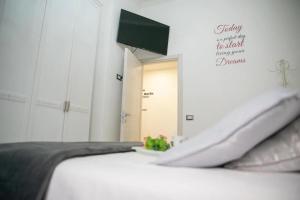 a bedroom with a bed and a mirror and a door at Central Luxury Apartment in Lido di Ostia