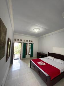 Katil atau katil-katil dalam bilik di Kuta Lombok Homestay