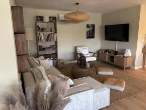 Posezení v ubytování Chez Flo la suite