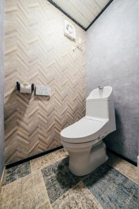 a bathroom with a white toilet in a room at T-Base 01 in Tateyama +30 photos