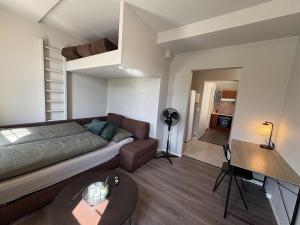 a living room with a couch and a loft at Notodden Sentrum Apartment NO 13 in Notodden