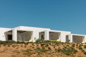 a white house in the middle of a desert at TWWO Antiparos in Antiparos +33 photos