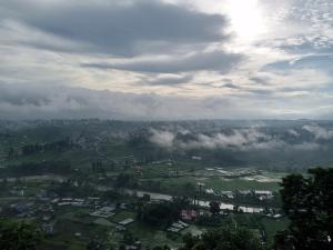 a view of a city with clouds in the sky at Hotel Sabaiko in Kathmandu
