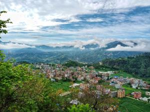a view of a city with mountains in the background at Hotel Sabaiko in Kathmandu