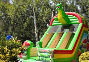 a colorful inflatable bounce house at a park at Prawdzic Family Resort & Wellness in Gdańsk