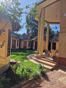 a courtyard of a home with a patio at White House of Tanzania in Arusha