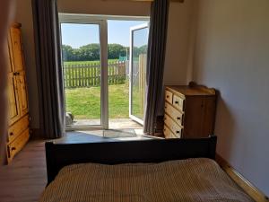 Postelja oz. postelje v sobi nastanitve Sunriseview Cottages