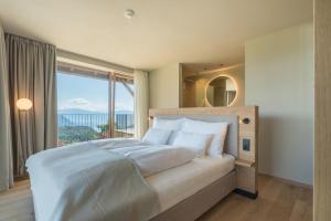 Ένα ή περισσότερα κρεβάτια σε δωμάτιο στο Hotel am Hang