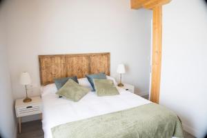 Ένα ή περισσότερα κρεβάτια σε δωμάτιο στο VIA DE LA PLATA SUITES 1a +8 φωτογραφίες