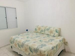 Ένα ή περισσότερα κρεβάτια σε δωμάτιο στο Ground floor apartment accommodation in Itanhaem