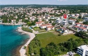 an aerial view of a town next to the ocean at Nice Apartment In Malinska With Wifi in Malinska +16 photos