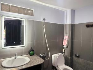 a bathroom with a sink and a toilet at Four P Home - Binh Thanh in Ho Chi Minh City +32 photos
