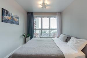 Ένα ή περισσότερα κρεβάτια σε δωμάτιο στο Petrovdom Apartments 16-77b in RC Kvartet, Vasyl Lypkivskyi 16b