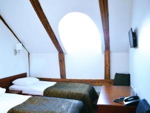 Postel nebo postele na pokoji v ubytování Gotthard Residents