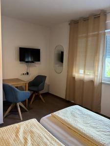 Televiisor ja/või meelelahutuskeskus majutusasutuses Privatzimmer Jarosch +5 fotot