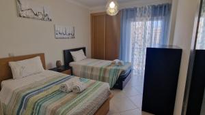Postel nebo postele na pokoji v ubytování Apartamento Praia SIS
