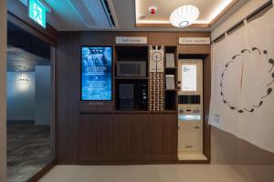 a lobby of a office with a computer on the wall at Yuhyu Ryokan Hotel in Seoul