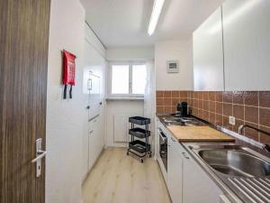 Kuchyň nebo kuchyňský kout v ubytování Apartment Chesa Ova Cotschna 606 by Interhome