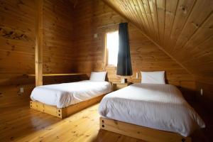 Postel nebo postele na pokoji v ubytování パウダー小屋