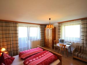 A bed or beds in a room at Apartment Jägerhof-3 by Interhome