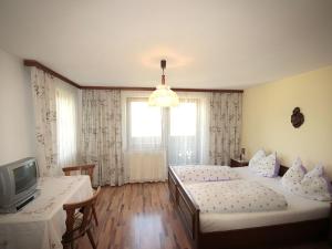 A bed or beds in a room at Apartment Jägerhof-3 by Interhome