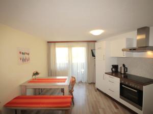A kitchen or kitchenette at Apartment Jägerhof-3 by Interhome