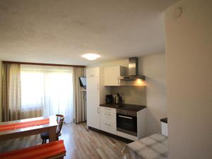 A bed or beds in a room at Apartment Jägerhof-3 by Interhome
