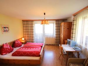 A bed or beds in a room at Apartment Jägerhof-3 by Interhome