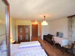 A bed or beds in a room at Apartment Jägerhof-3 by Interhome