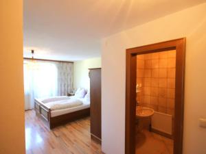 A bed or beds in a room at Apartment Jägerhof-3 by Interhome