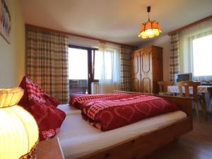 A bed or beds in a room at Apartment Jägerhof-3 by Interhome