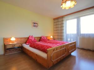 A bed or beds in a room at Apartment Jägerhof-3 by Interhome