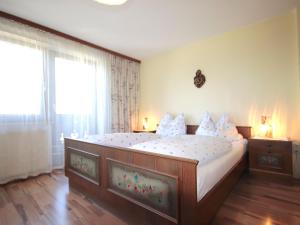 A bed or beds in a room at Apartment Jägerhof-3 by Interhome