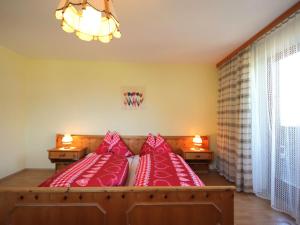 A bed or beds in a room at Apartment Jägerhof-3 by Interhome