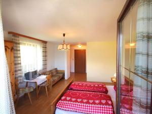 A bed or beds in a room at Apartment Jägerhof-3 by Interhome